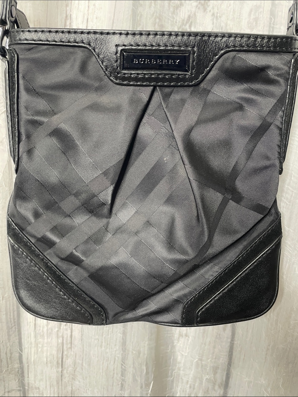 Burberry Black Signature Check crossbody/shoulder bag.